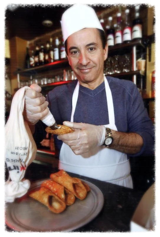 Baby John filling a cannoli at Caffè Palermo